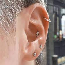 Decorate Your Ear With An Assortment Of White Gold And Diamond Pieces This Curatedear Incorporates Many Of Our Most Popul Earings Piercings Ear Ear Piercings