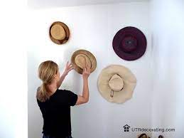 How To Turn Stylish Hats Into Wall Decor Hanging Hats Hat Wall Hat Wall Display