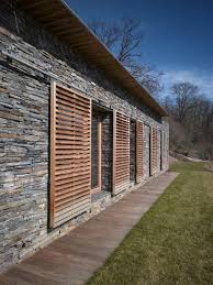Large Wooden Louver Panels On A Track System Outdoor Shutters Shutters Exterior Cedar Shutters