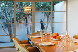 4 dining place settings with cupcake/candle holder centerpiece. Pears In Dish On Dining Room Table Stockphoto