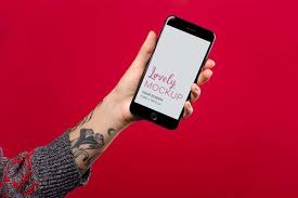 Mockup Featuring A Woman S Tattooed Arm Holding A Space Gray Iphone 8 Against A Red Surface Lovely Mockups Mockup Arm Tattoo Photo Dimensions