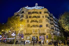 Near the casa battlo, on crossing of boulevard gracie with provence street, rises the huge cave rock of the casa mila. Gaudi Casa Mila In Barcelona Catalunya Spain