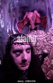 This Thursday, Sept. 22, 2011 photo shows an actor in costume and makeup as  he poses in his setting at the House of Shock, a haunted house, in New  Orleans. Halloween-season attractions