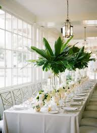 Check spelling or type a new query. Tall Centerpieces In Clear Glass Vases With Palm Leaves Are Great For A Southern Or Tropical Wedding Happywedd Com