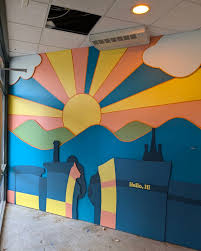 Installation of this die cut mural at Hello, Hi today with help from  @at__________space. Paintings by @baileymonty.vt. Cutouts in MDF made