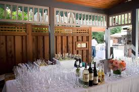 Example Of Bar Setup Front Of Bar 8 Ft King S Table On Stilts With Full Drape Linen Patterson Natural Trio Of Lan Event Bar Wine Reception Reception Bar