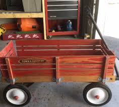 The differences are mainly cosmetic and this model is a little smaller as well. Radio Flyer Wooden Wagon Shop Clothing Shoes Online
