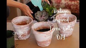 Brush the design onto the pot in white. Vintage Inspired Terra Cotta Pot Diy White Washing Pots Rust Oleum Chalked Paint Youtube