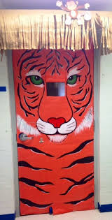 Tiger Themed Classroom Door Door Covered With Orange Paper And Painted With Acrylic Paint Classroom Door Door Decorations Classroom Animal Decor