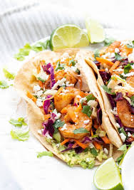 Place coleslaw mix, green onions, and cilantro into a large bowl. Spicy Shrimp Tacos With Cilantro Lime Slaw Haute Healthy Living