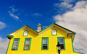 The green siding pairs particularly nicely with the natural wood next to the front door. Yellow House Green Trim Blue Sky Copyright C 2011 By Bur Flickr