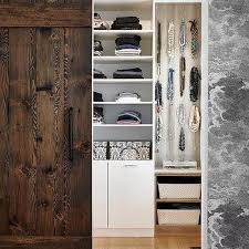 Modern masculine wardrobe with frosted sliding doors. Walk In Closet Barn Door Design Ideas