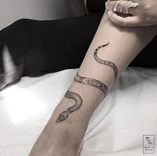 Snake coiled around arm tattoos for men continue on snake around arm tattoo meanings snake around arm tattoo meanings patience healing protection knowledge. 90 Slithering Snake Tattoos For Men And Women To Wear Around Arm Tattoo Wrist Tattoos For Women Feminine Tattoos