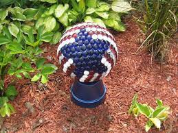 Mosaic artist karen silton instructing how to mix thinset and attach mirror and china plate pieces to a garden gazing ball. Meeting Nell Stelzer Bowling Ball Crafts Bowling Ball Art Mosaic Bowling Ball