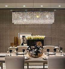 The whites just make the reds, blues and grays in this space fit in like a shoe or something. Modern Crystal Chandeliers For Dining Room How To Take Your Pick Modern Crystal Chandelier Crystal Chandelier Dining Room Dining Room Chandelier