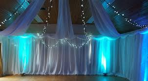 Ceiling draping really helped in the transformation of this warehouse space to a beautiful wedding ceremony setting. Ceiling Drapes And Overhead Drapes For Weddings