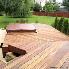 A Multilevel Deck Separates Different Deck Areas For Different Purposes In Other Words Deck Levels Define The Outsi Hot Tub Backyard Deck Design Hot Tub Deck