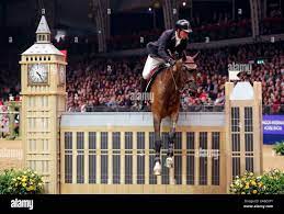 Guy Williams riding Cupido competes in the Musto inside edge stakes during  day three of The London International Horse Show at London Olympia Stock  Photo - Alamy