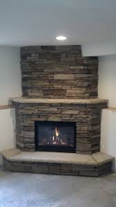 Fireplaces can be added to indoor or outdoor spaces and come in a variety of designs to match your style. Great American Fireplace Installed This Corner Gas Fireplace With Cultured Drystack Ledgestone Corner Gas Fireplace Cottage Fireplace Farmhouse Fireplace Decor