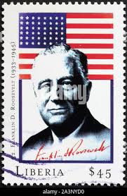 Il presidente Franklin D. Roosevelt e bandiera sul francobollo Foto stock