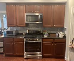 Choose neutral shades like white, beige or gray to make black pop and give the bathroom a genocide appeal. Advice On What Color To Refinish Paint My Kitchen Cabinets I Have Cherry Wood Floors Dark Granite And Light Gray Walls What Color Cabinets Would You Recommend Kitchen