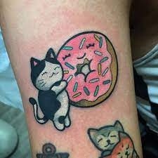 Donut Tattoo By Christina Hock Christinahock Dolorosatattooco Donut Kitten Cat Kawaii Cute Donut Tattoo Candy Tattoo Panda Tattoo