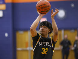 Power surge: Javion Grizzle and Dominic Smith provide sizzle off the bench  for Metea Valley. 'Be like a spark plug.'