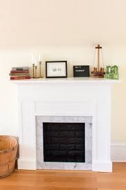 These recent project photos show how refinishing a brick fireplace surround with fauxpanels is one simple update that can make a huge difference to the look and feel of your home. Diy Faux Fireplace Mantel With Tile And Faux Brick