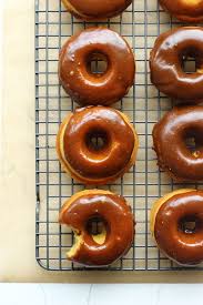 Baked Pumpkin Donuts With Caramel Glaze Pumpkin Donuts Baked Pumpkin Delicious Donuts