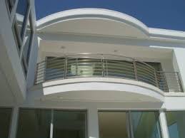 Find modern but simple balcony grill & railing designs with glass made of ss steel, wooden & iron for apartmentâ€™s safety for terrace of indian house. Stainless Steel Balcony Rail Balcony Grill Design Balcony Railing Design Balcony Railing