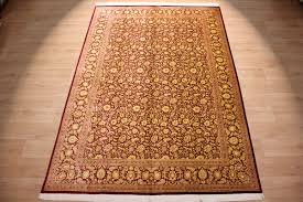 Next, lift up the edges of carpet and spread a thin layer of carpet adhesive on the floor where they will meet. Perser Teppich Gom Seidenteppich 294x196 Cm Gold Rot