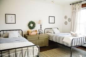 Kid's bedroom ideas with shiplap wall and farmhouse style decor. Kindred Homestead