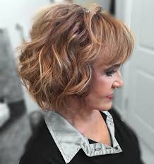The short hairstyle with bangs and layers are lifted to a whole new level with the green/ teal colored highlights. 21 Best Hairstyles For Women Over 60 To Look Younger 2021 Trends