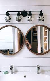 Modern meets eclectic in this amazing bath remodel bathroom mirrors trendy round mirror. Rustic Bathroom Circle Mirror Cage Lights Vanity Ikea Sink Bathroom Rustic Bathroom Bathroom Lighting Bathroom Light Fixtures