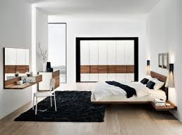 Black And White Bedroom With Wood Furniture The Floating Natural Wood Bed Turns This Contemporary Black White Bedroom Into Modern Master Bedroom Modern Master Bedroom Design Walnut Bedroom Furniture