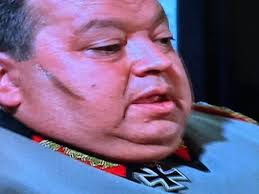 What is the origin of Burkhalter's scar in Hogan's Heroes?