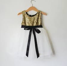 Black And Gold Theme Clothes A Sparkling Touch Of Gold Sequined Flower Girl Dress With White Tulle Skirt The Bac Gold Flower Girl Dresses White Flower Girl Dresses Childrens Party Dresses
