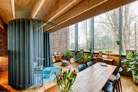 Extending dining table and chairs ukrainian news anchor. Circular Brick House By Ast 77 Architecten Pays An Ode To Rammed Earth