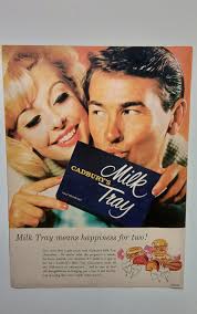CADBURY'S Milk tạy Milk Τναу means happiness for two! Give every date gula  touch with Cadbury' Tray program- norle, xerial spin Chocolate lates make  saire nother munical, Savourite the Cadhary's Milk Tray