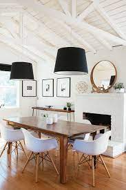 The squareness of the furniture enhances the rustic look of the table. How To Create An Affordable Modern Rustic Dining Room Posh Pennies