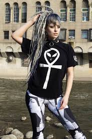Selective focus of stylish ginger woman adjusting eyeglasses near car at urban street. Pin On Streetwear Tees