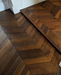 Dark Chevron Floor Fitted With A Small Step Notice How The Pattern Of The Chevron Continues So The Step Doesn T Interrupt T Chevron Floor Flooring Wood Floors