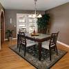 Getting a rug for your dining room can give it a cozier atmosphere. 3
