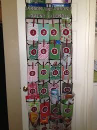 Advent Calendar Made From Scrapbook Paper Clothespins And An Over The Door Shoe Holder Scrapbook Paper Door Decorations Clothes Pins