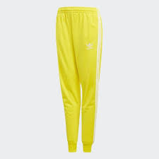 Black And Yellow Adidas Track Pants Shop The Sst Track Pants Yellow At Adidas Com Us See All The Styles And Colors Of Sst Track Pants Yellow At Yellow Pants Outfit Adidas Pants Yellow Adidas