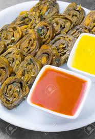 As gujarati cuisine is becoming more and more popular day by day worldwide, we promise to try to accommodate links of gujarati recipes presented in english language online too in future on this page. Indian Spicy Food Patra Also Called Paatra Alu Vadi Or Patrode Stock Photo Picture And Royalty Free Image Image 115197143