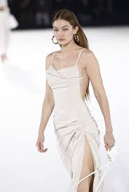 She has also appeared on the reality tv series the real housewives of beverly hills, in which her mother yolanda hadid has starred since season three in 2012. Gigi Hadid Cream Jacquemus Backless Dress Ramp Walk Paris 2020 On Sassy Daily Runway Fashion Dresses Gigi Hadid Outfits Gigi Hadid Dresses