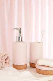 Pink Bathroom Accessories Uk Decoomo Soap dispenser, tooth brush holder, cotton towels plus roll top bath and pink bathroom tiles.
