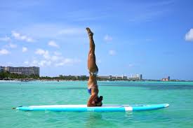 Pin By Thetravelyogi On On Retreat Aruba Paddle Board Yoga Paddle Boarding Yoga Girl