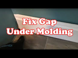 Expert installers say that the larger the space, the larger the expansion gap should be, as the floor needs more space to expand and contract with the gap between my laminate and tile is to wide for the transition piece. How To Fix Gap Under A Floor Molding Quick Fix Youtube